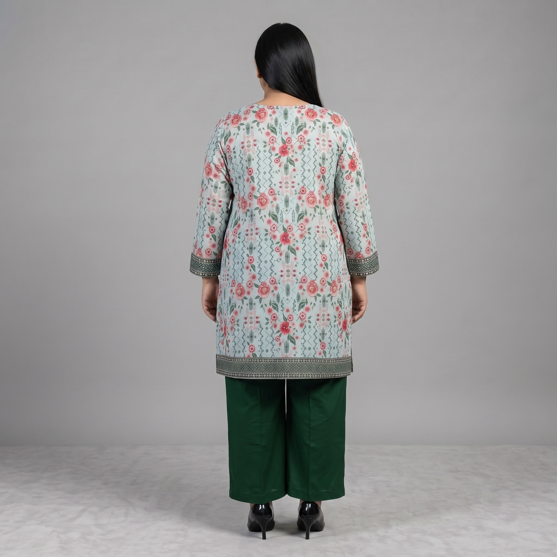 Woman wearing a Mint Blossom Printed 3-Piece Suit featuring a mint floral printed straight-fit shirt, green trousers, and a pink floral printed dupatta with decorative border.