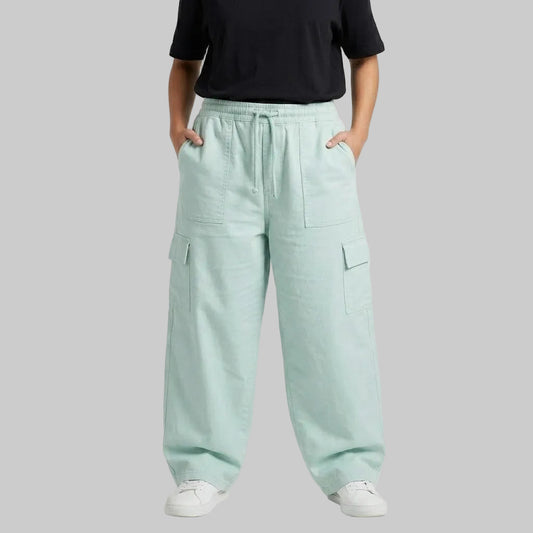 Mint Breeze Cargo Baggy Trousers crafted from premium 98% cotton, 2% elastane twill dyed fabric with a relaxed baggy fit, elastic waistband, and functional cargo pockets.