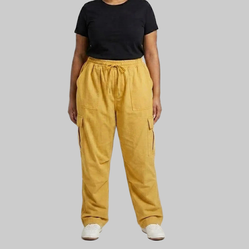 Mustard Gold Cargo Baggy Trousers made from premium 98% cotton, 2% elastane twill dyed fabric featuring a relaxed baggy fit, elastic waistband, and utility cargo pockets.