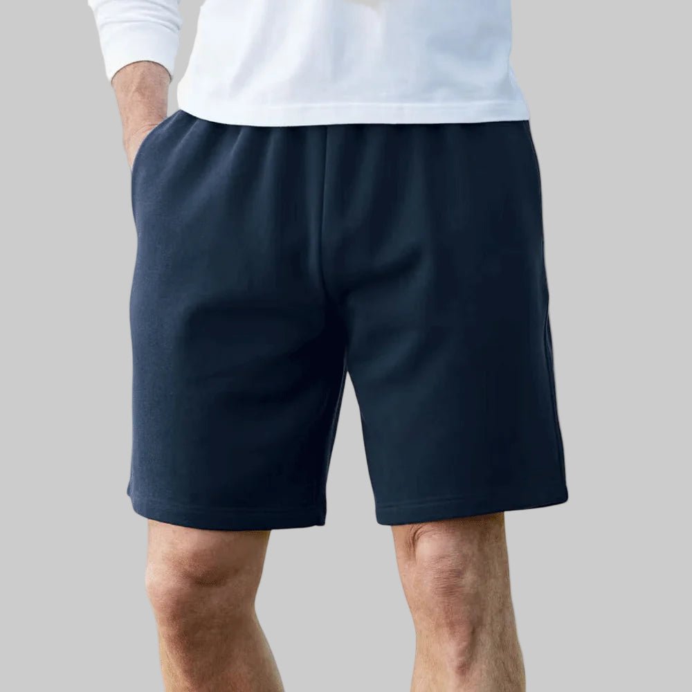 Plus-size fleece shorts with a relaxed fit, concealed drawstring waist, and side pockets for comfort and convenience.
