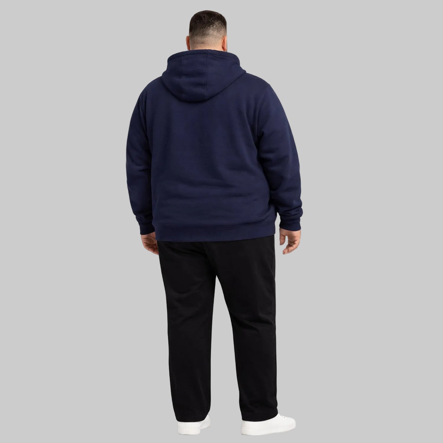 Navy blue classic full-zip fleece hoodie worn by plus-size male model, front view