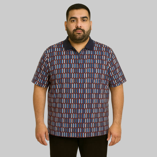 Plus-size Pakistani male model wearing navy geo colorblock quarter-zip polo shirt with ribbed collar on a clean studio background.