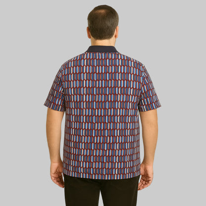 Plus-size Pakistani male model wearing navy geo colorblock quarter-zip polo shirt with ribbed collar on a clean studio background.