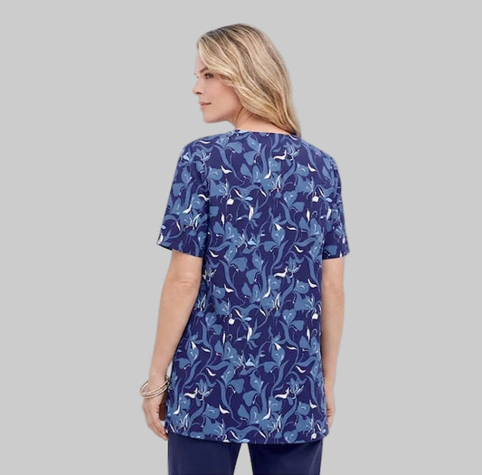 Plus-size soft knit tunic with a relaxed fit, 32” length, and breathable cotton/poly fabric. A timeless and comfortable everyday classic.