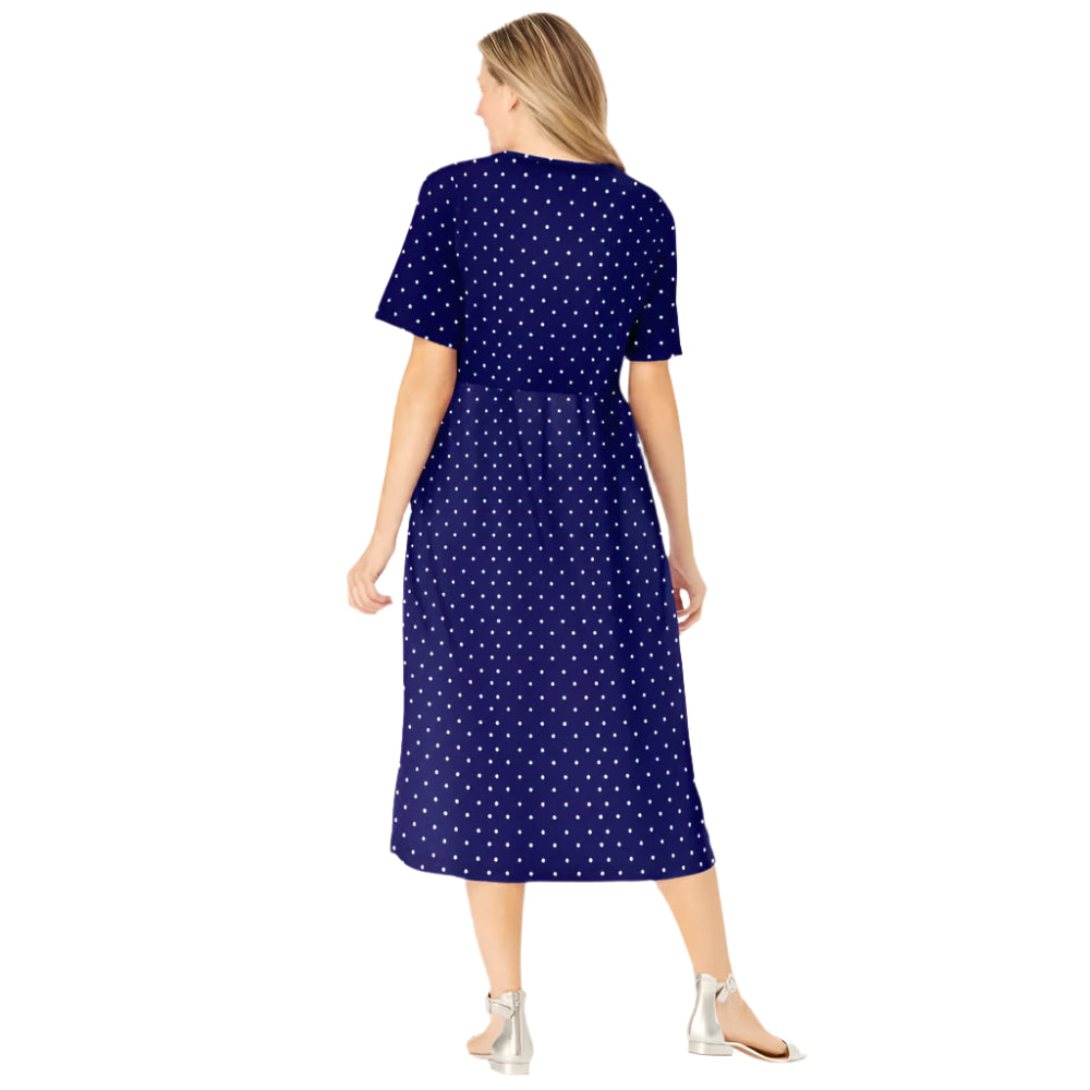 Woman wearing navy polka dot button-front dress with gathered waist and elbow sleeves