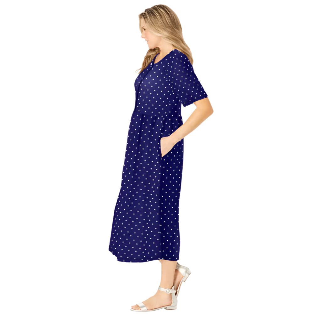 Woman wearing navy polka dot button-front dress with gathered waist and elbow sleeves