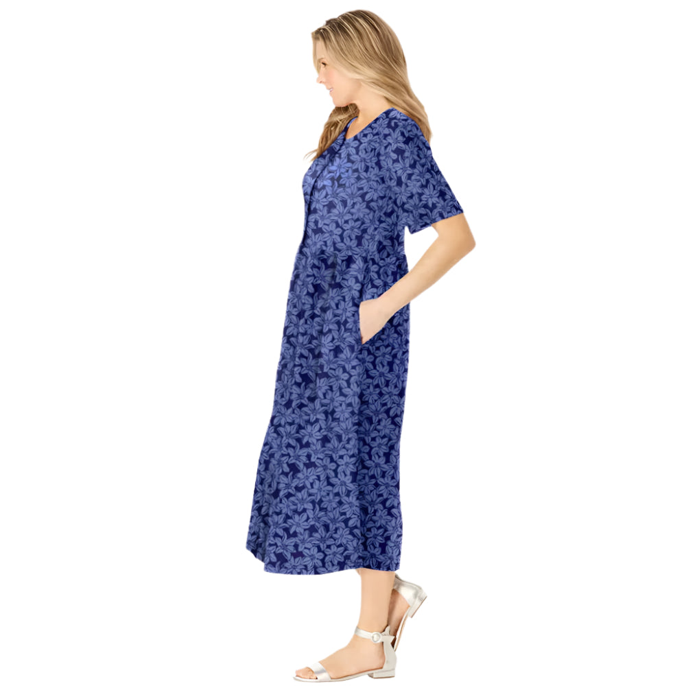Woman wearing navy floral button-front dress with gathered waist and elbow sleeves