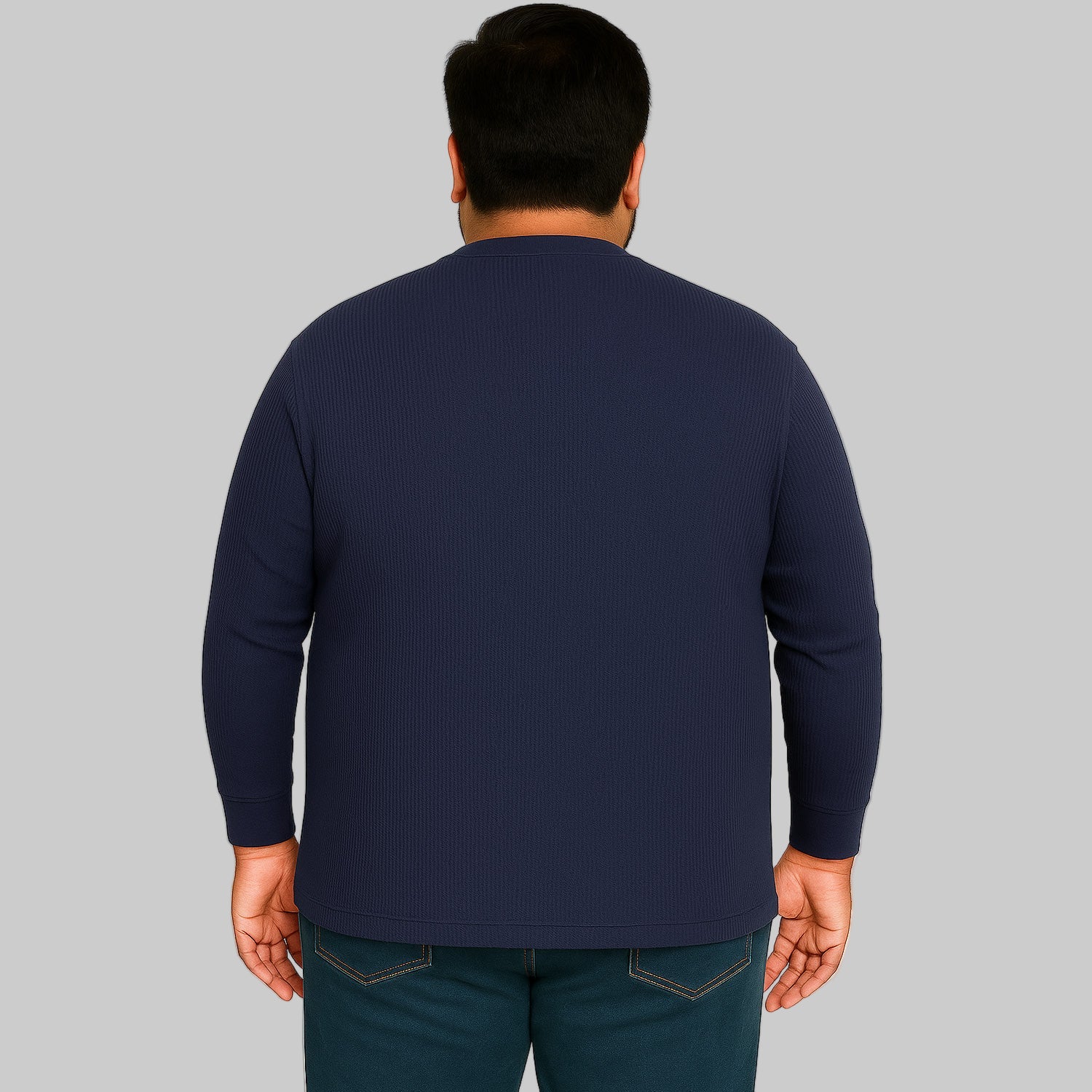 Model wearing navy waffle-knit thermal Henley tee with ribbed cuffs and five-button placket on a clean white background.
