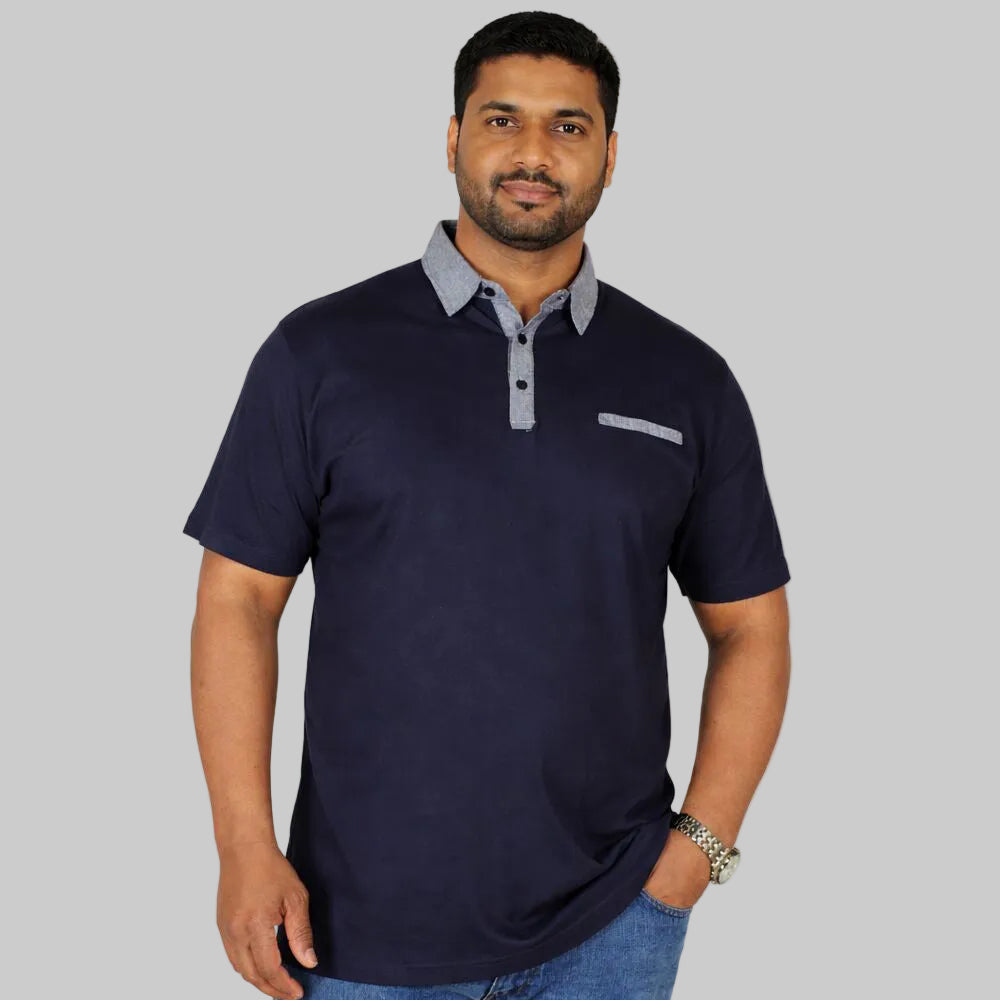 Plus size male model wearing navy polo shirt with grey contrast collar and trim front view