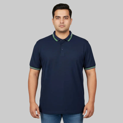 Navy plus size polo shirt with green tipped collar laid flat showing front view and contrast collar detail