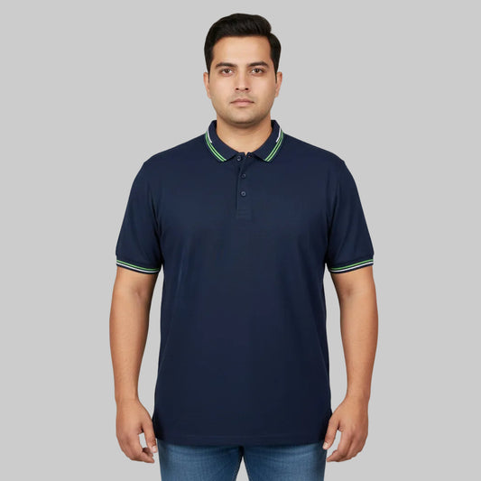 Navy plus size polo shirt with green tipped collar laid flat showing front view and contrast collar detail