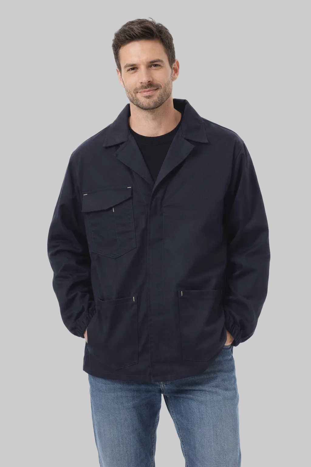 Man wearing a navy jacket and jeans on a white background