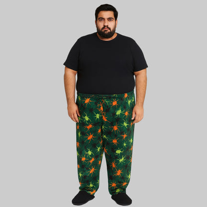 Plus-size Neon Spiders flannel pajama pants with colorful novelty print, elastic waistband, drawstring, and side pockets.