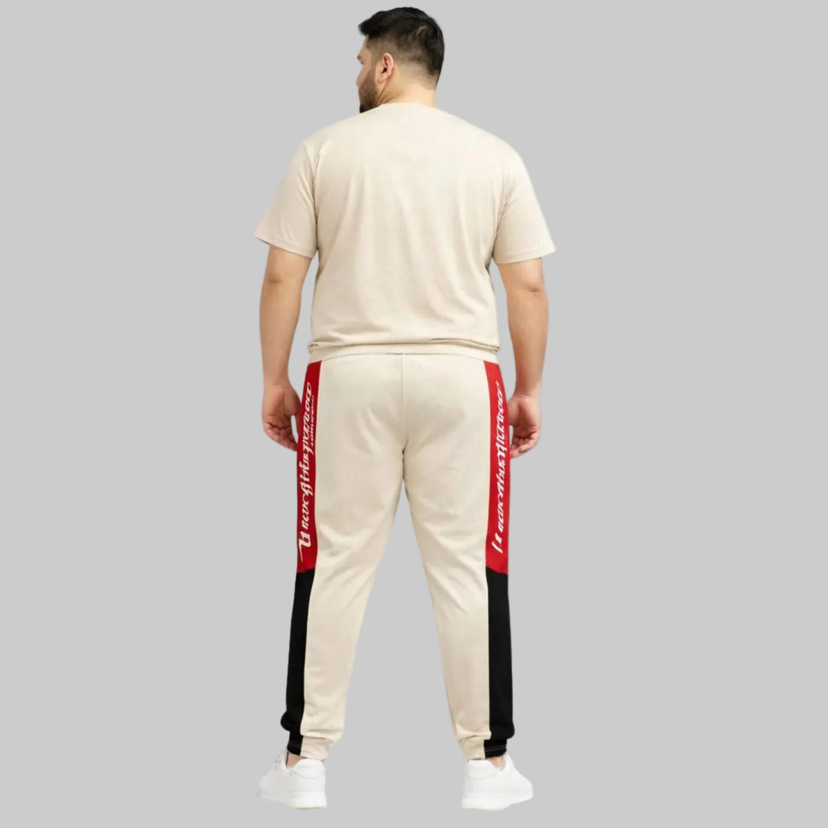 Plus size New York Script side panel athletic joggers with elastic waistband, drawstring, and ribbed cuffs, designed for a relaxed sporty fit