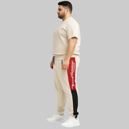 Plus size New York Script side panel athletic joggers with elastic waistband, drawstring, and ribbed cuffs, designed for a relaxed sporty fit