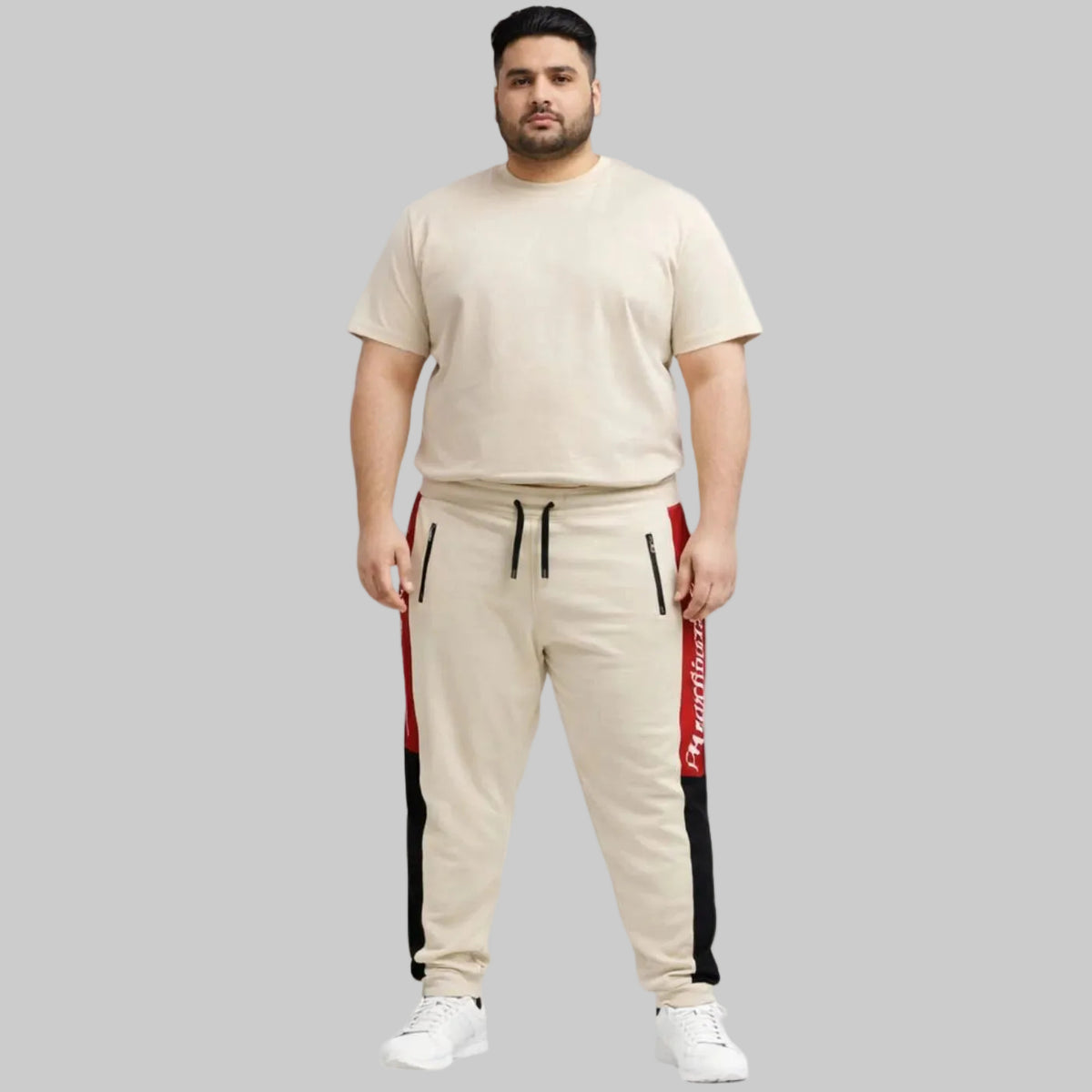 Plus size New York Script side panel athletic joggers with elastic waistband, drawstring, and ribbed cuffs, designed for a relaxed sporty fit
