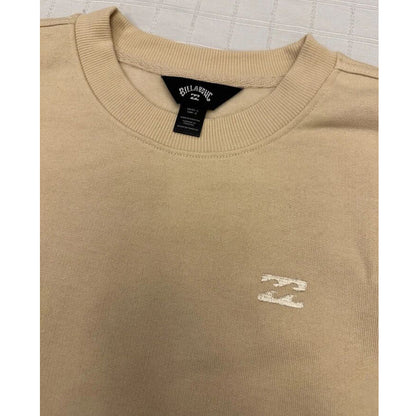 Close-up of fleece texture and ribbed crew neckline in oat tan sweatshirt