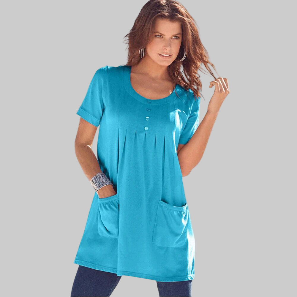 Ocean blue plus-size long-sleeve soft knit tunic with two pockets, a scoop neckline, and a relaxed fit for comfort and style.