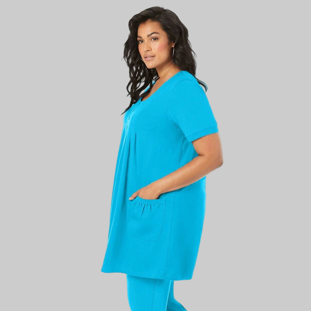 Ocean blue plus-size long-sleeve soft knit tunic with two pockets, a scoop neckline, and a relaxed fit for comfort and style.