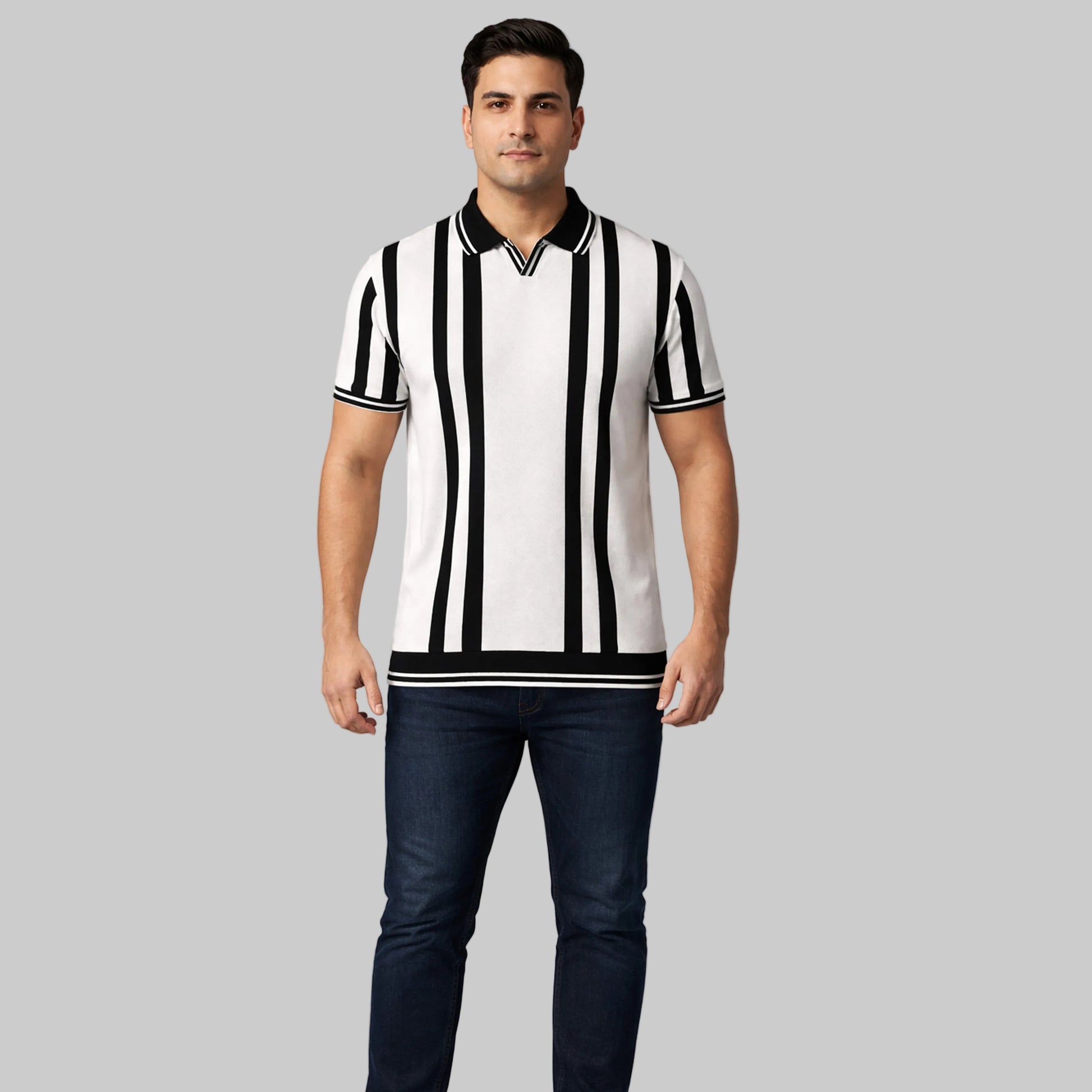 Off-white and black vertical stripe polo shirt worn by a male model, featuring short sleeves and a classic collar on a neutral studio background