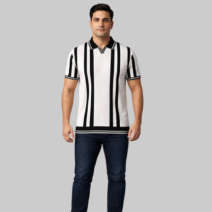 Off-white and black vertical stripe polo shirt worn by a male model, featuring short sleeves and a classic collar on a neutral studio background