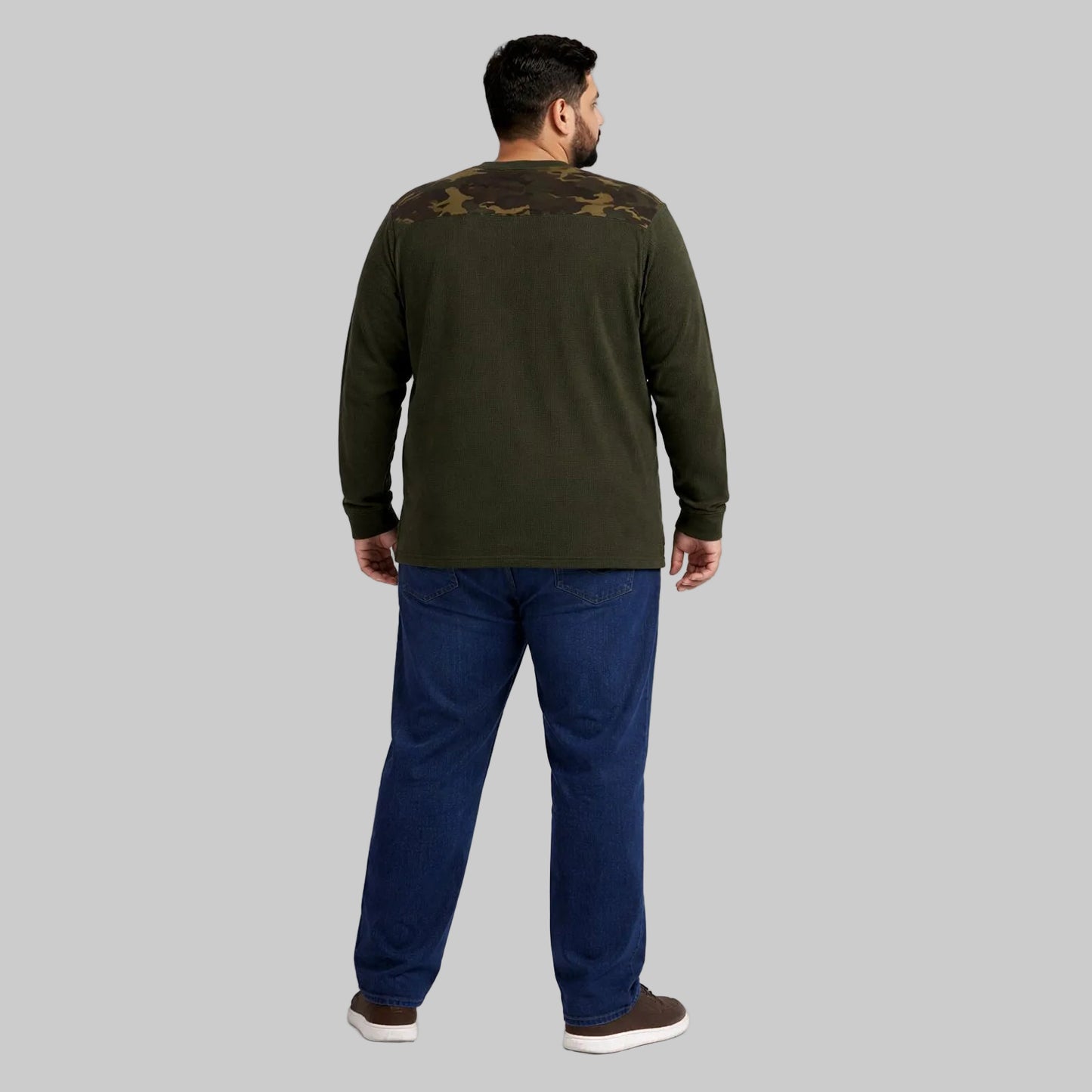 Olive green waffle-knit thermal shirt with camo shoulder panels worn by a plus-size model