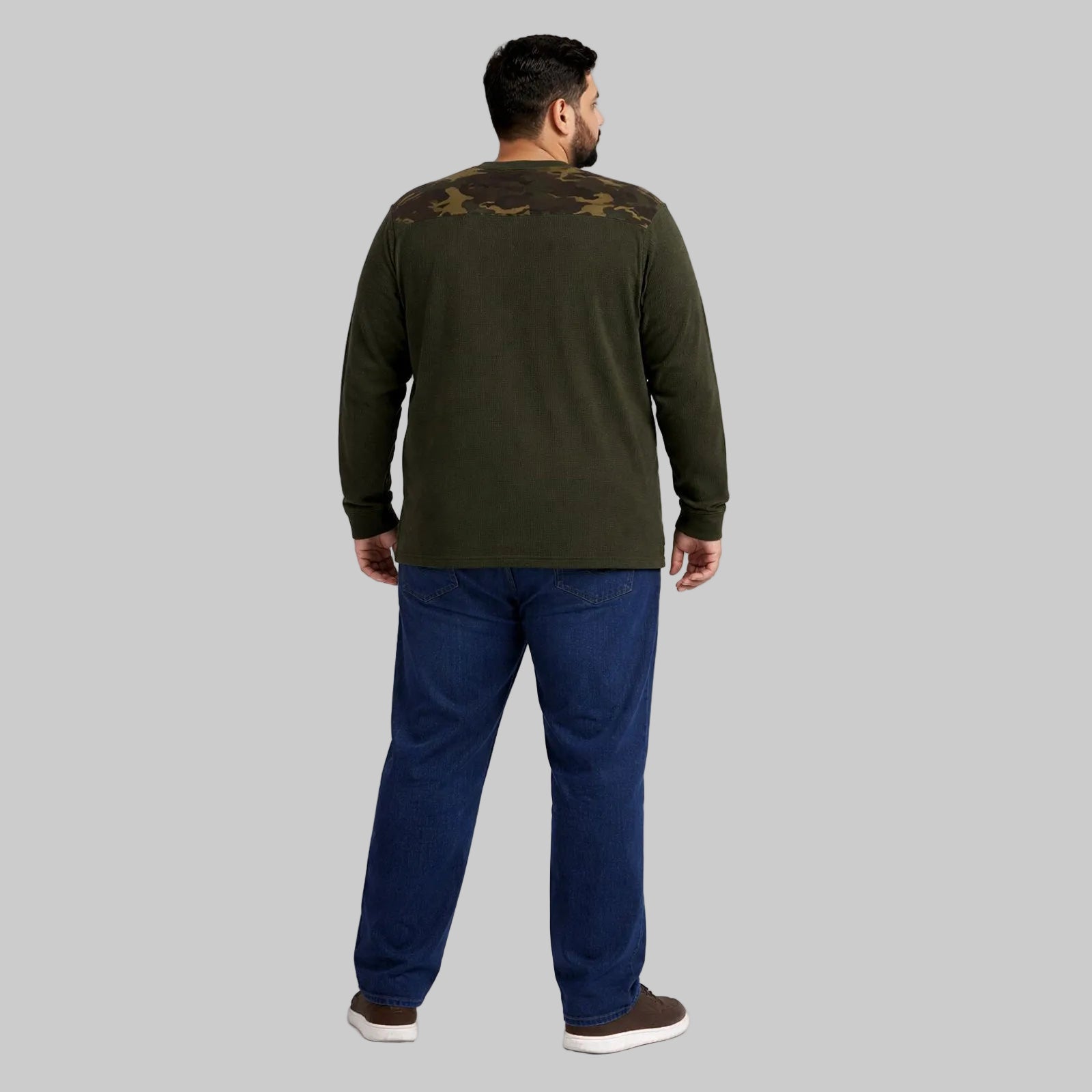 Olive green waffle-knit thermal shirt with camo shoulder panels worn by a plus-size model