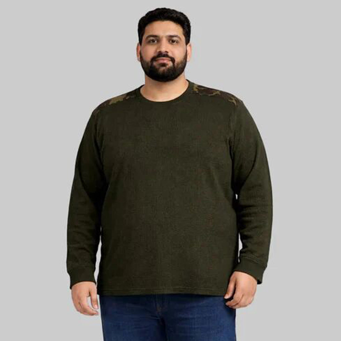 Olive green waffle-knit thermal shirt with camo shoulder panels worn by a plus-size model