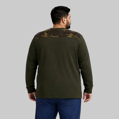 Olive green waffle-knit thermal shirt with camo shoulder panels worn by a plus-size model