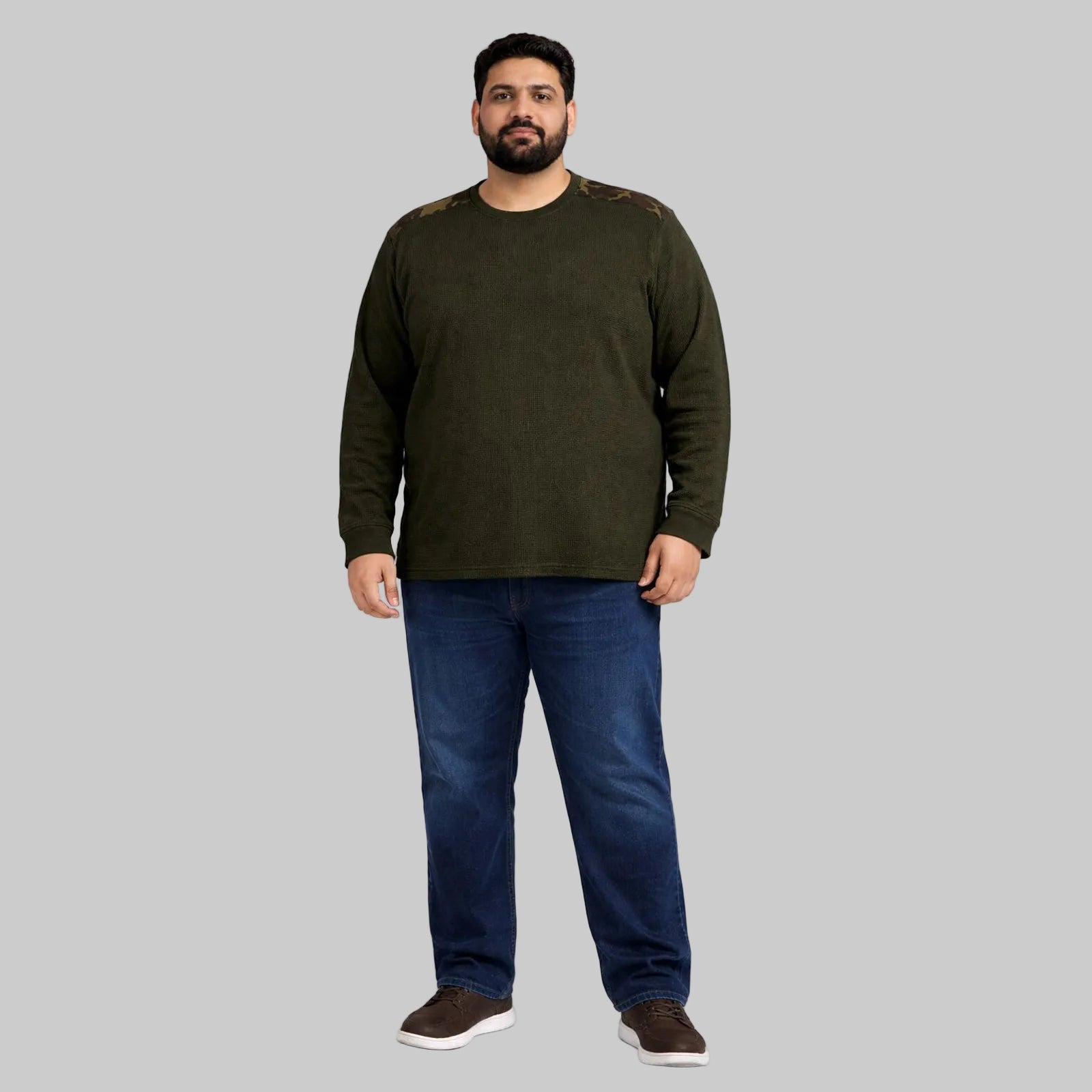 Olive green waffle-knit thermal shirt with camo shoulder panels worn by a plus-size model