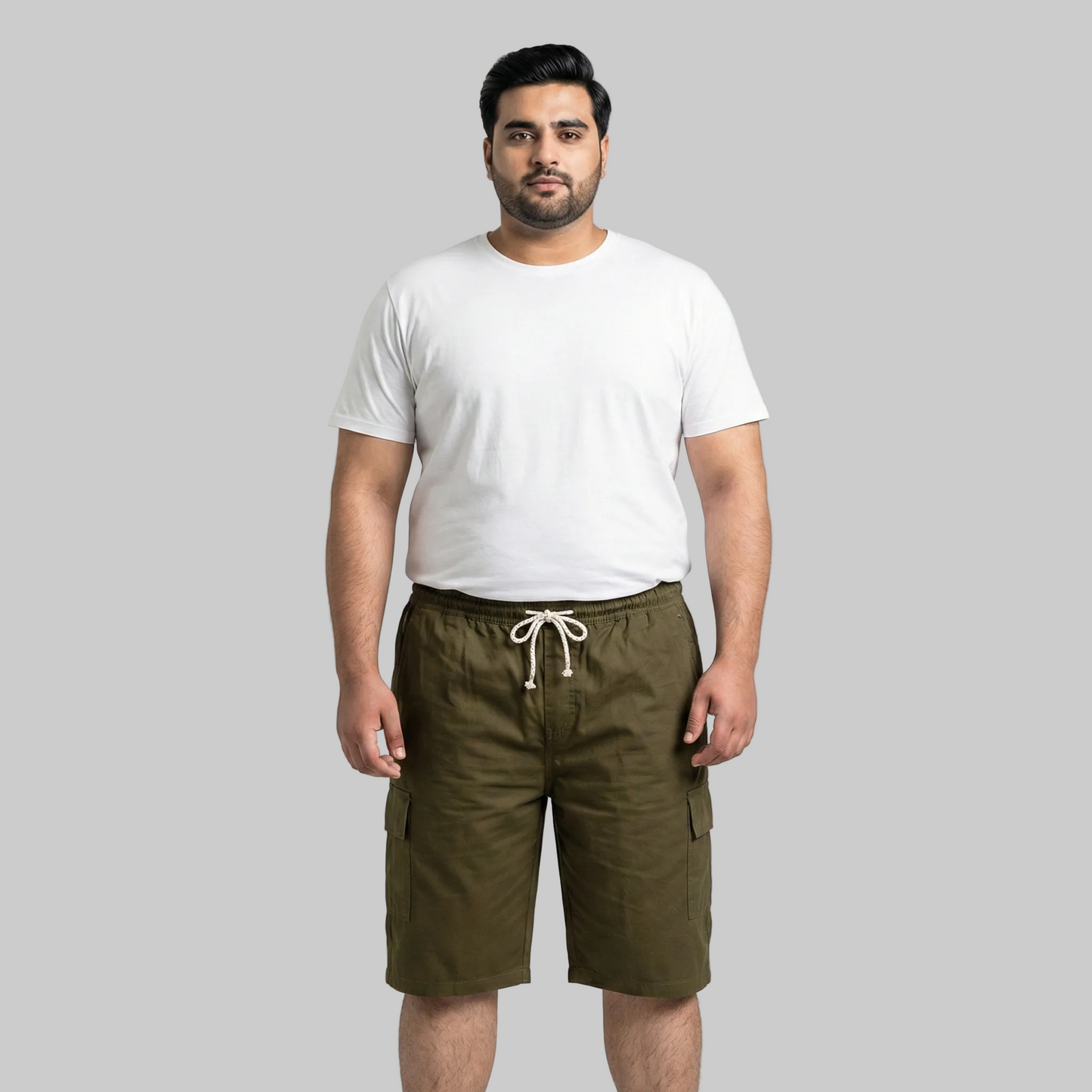 Olive green cotton elastic waist cargo shorts with drawstring and side pockets front view