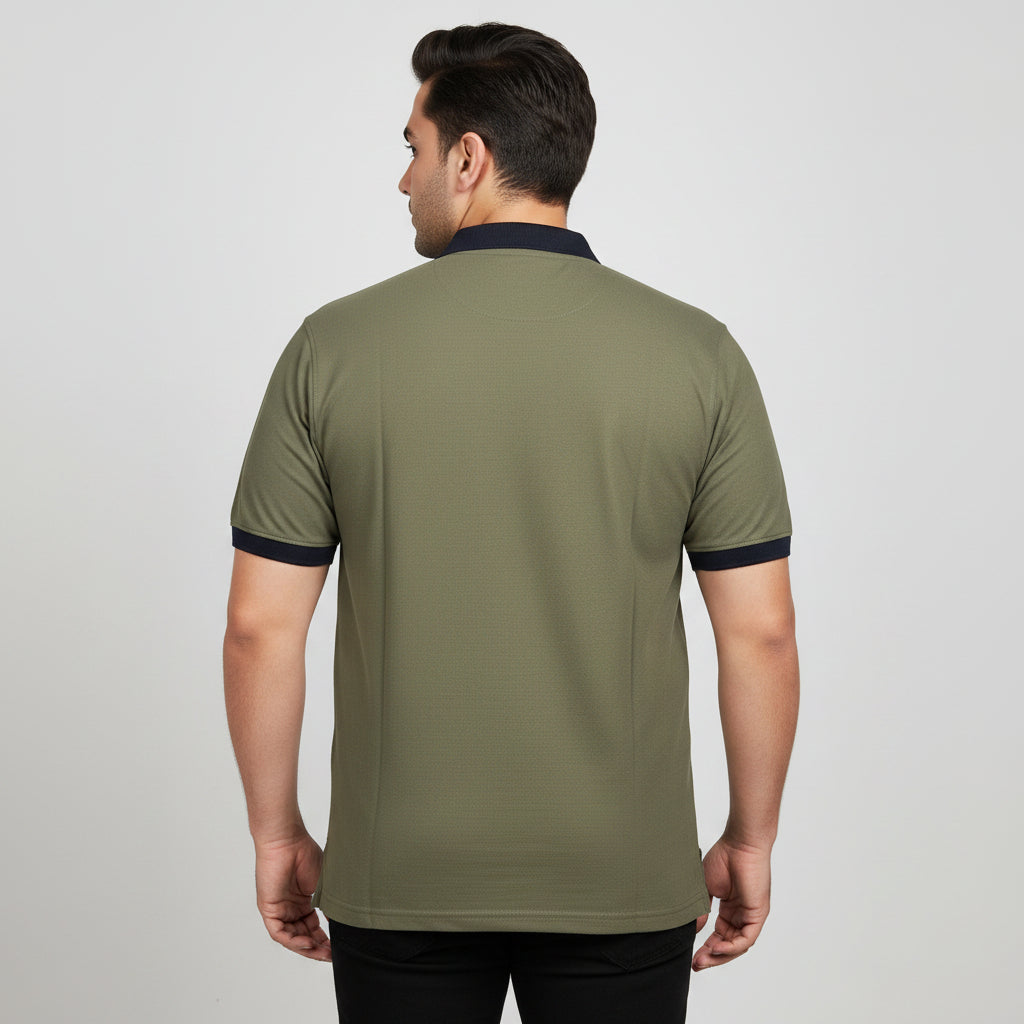 Alt Text: Men's olive green short-sleeve polo shirt featuring a contrast black collar and sleeve cuffs, laid flat on a light background.