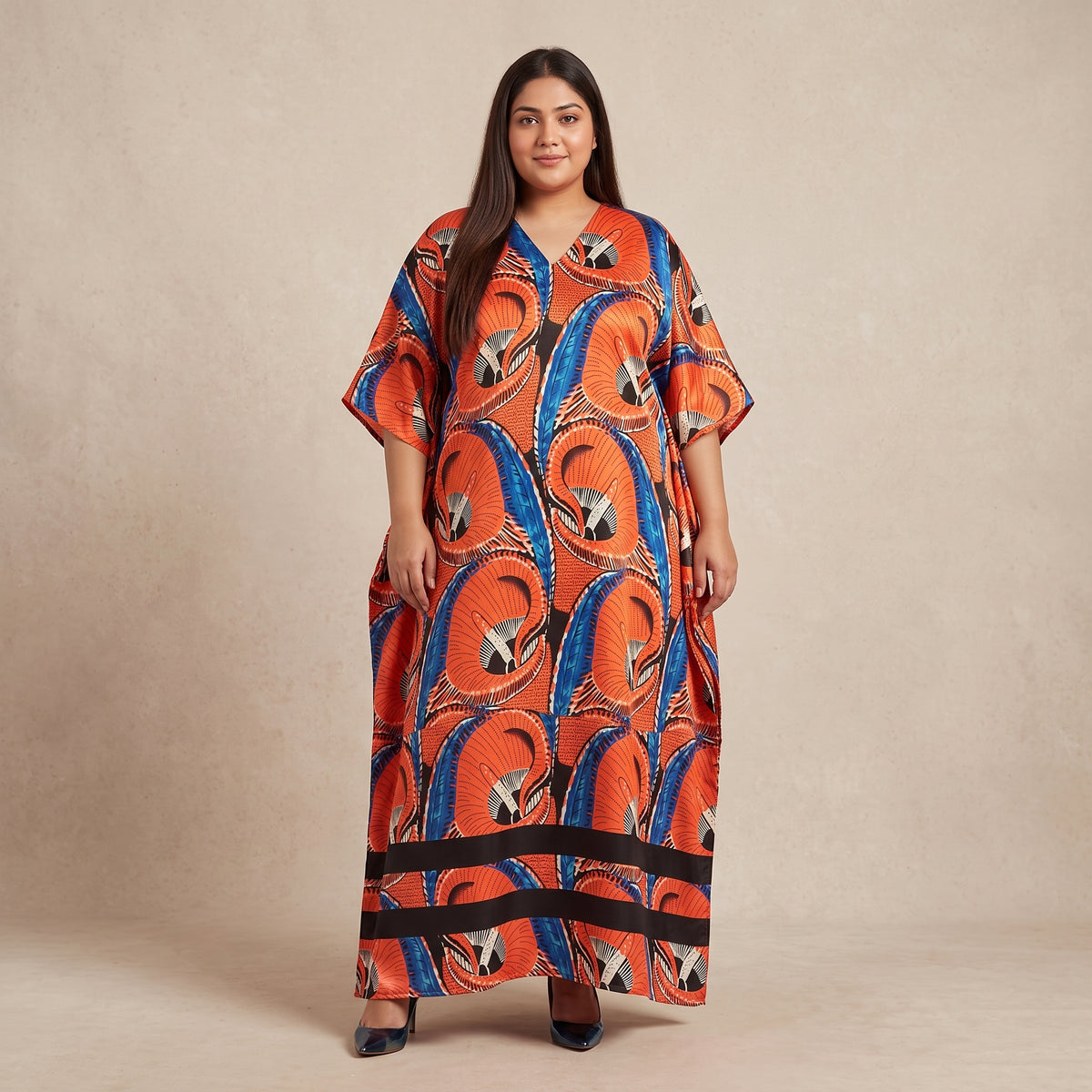 Orange and blue abstract swirl print maxi kaftan in lightweight polyester with a colorful pattern and flowing silhouette.