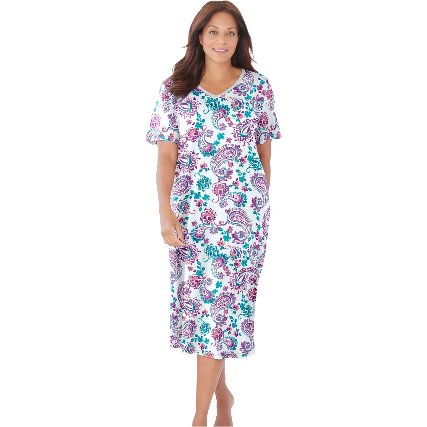 Woman in white sleepshirt with orchid paisley floral print and short sleeves