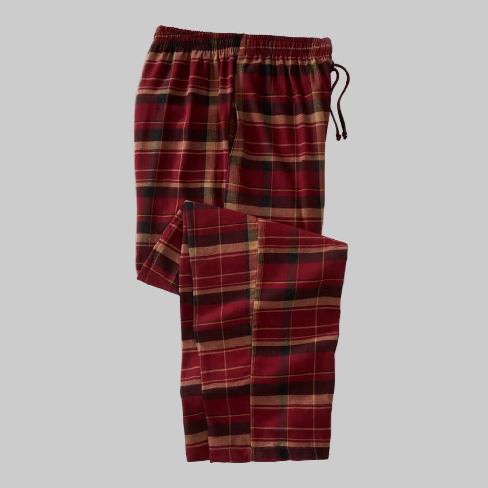 Oxblood plaid flannel pajama pants in red check pattern, relaxed fit with elastic waistband, drawstring, and side pockets, displayed flat on a white background.