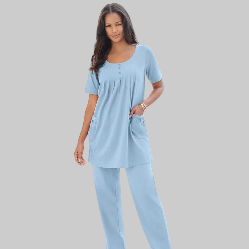 Pale Blue Two Pocket Soft Knit Tunic with short sleeves, scoop neckline, and a relaxed fit for everyday comfort and style.
