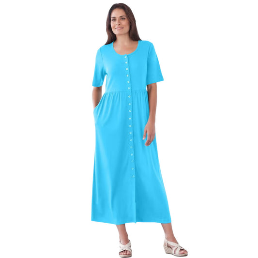 Plus-size button-front knit dress with a gathered waist, full skirt, elbow-length sleeves, and side seam pockets. Comfortable and stylish mid-calf length design.