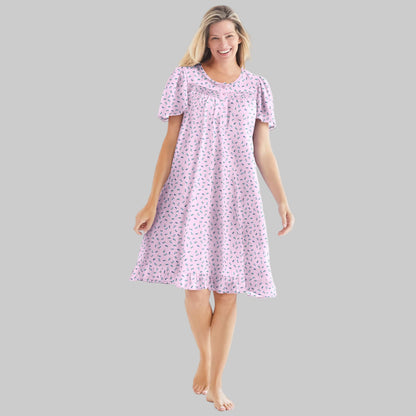 Pink ditsy floral short cotton nightgown with flutter sleeves, ruffled hem, and pintuck details — soft, breathable sleepwear for women.