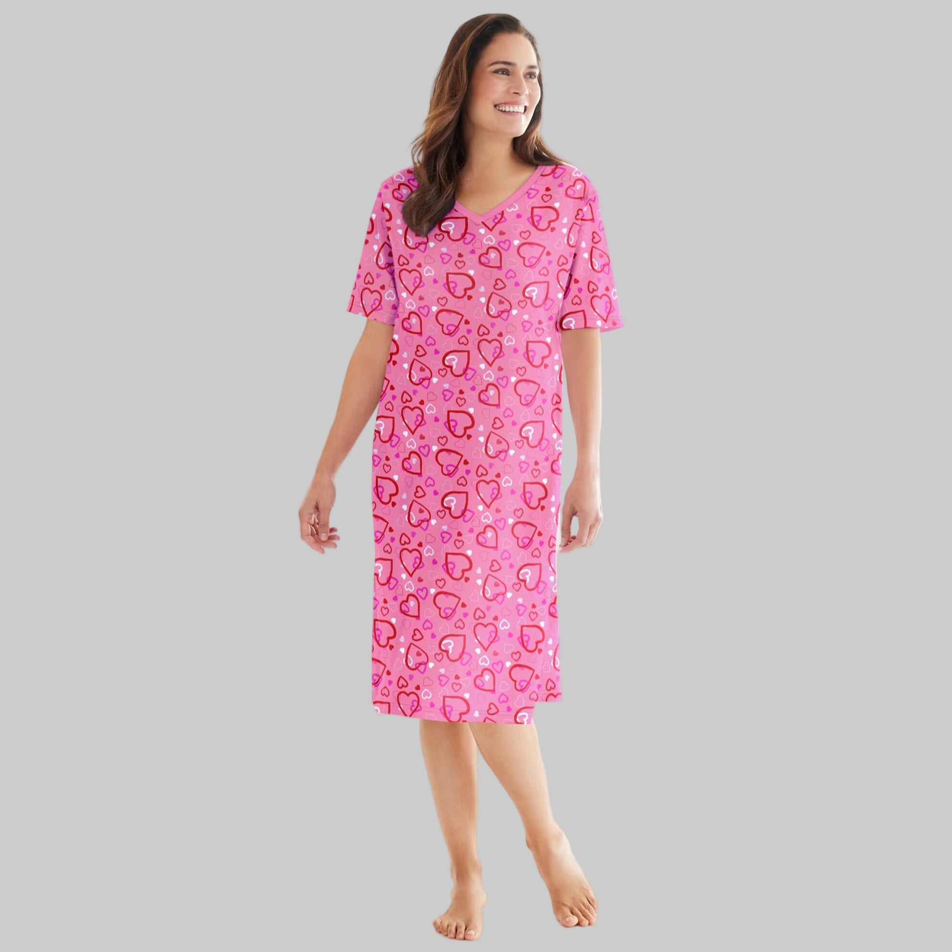 Plus size woman wearing a Pink Hearts Short Print Sleepshirt with ribbed V-neck, short sleeves, and fun heart print.