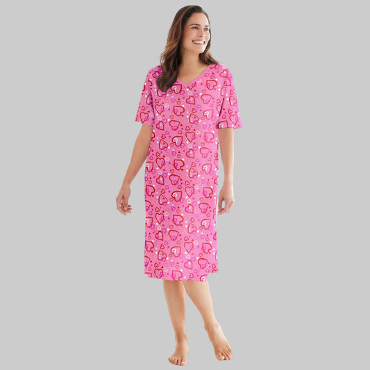 Plus size woman wearing a Pink Hearts Short Print Sleepshirt with ribbed V-neck, short sleeves, and fun heart print.