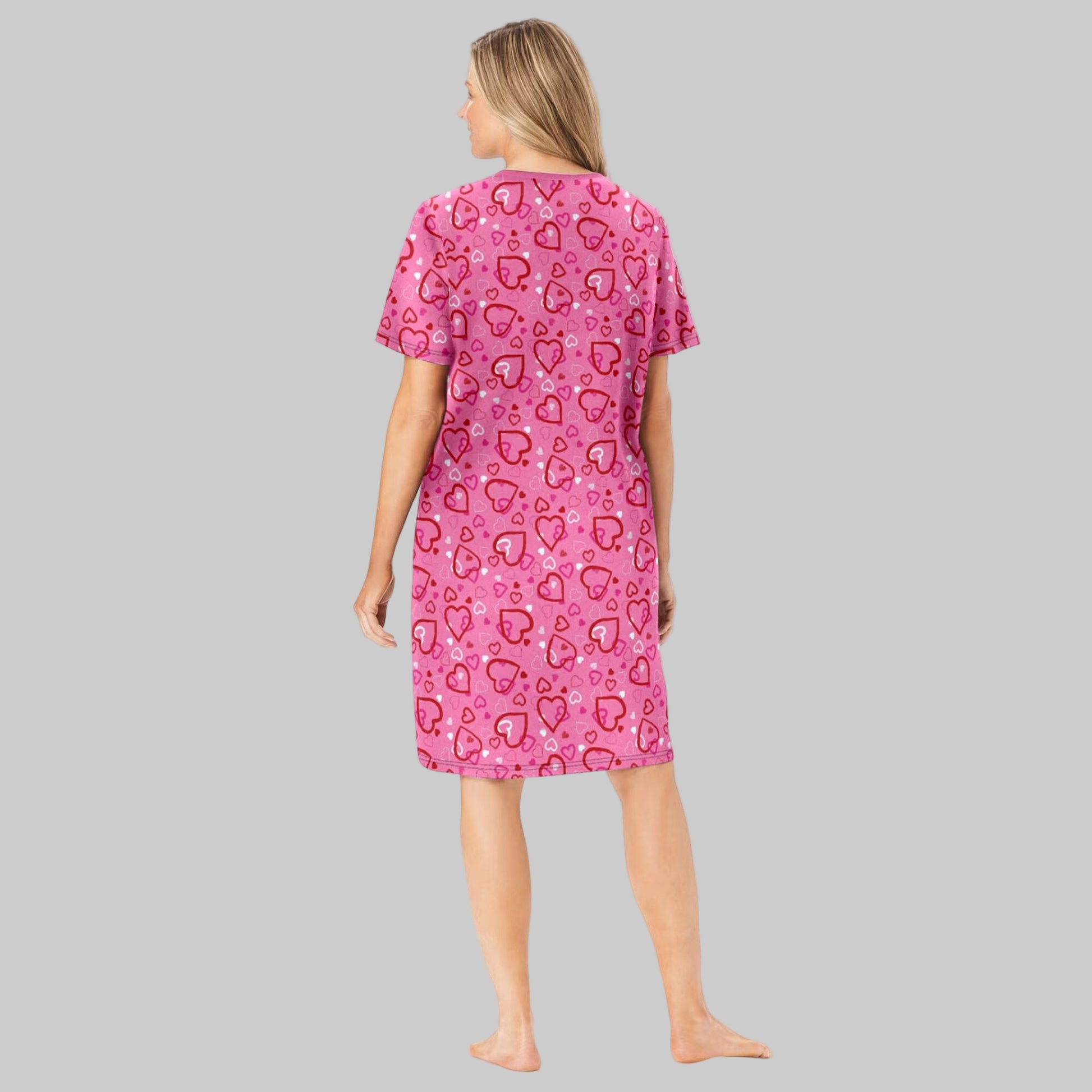 Plus size woman wearing a Pink Hearts Short Print Sleepshirt with ribbed V-neck, short sleeves, and fun heart print.