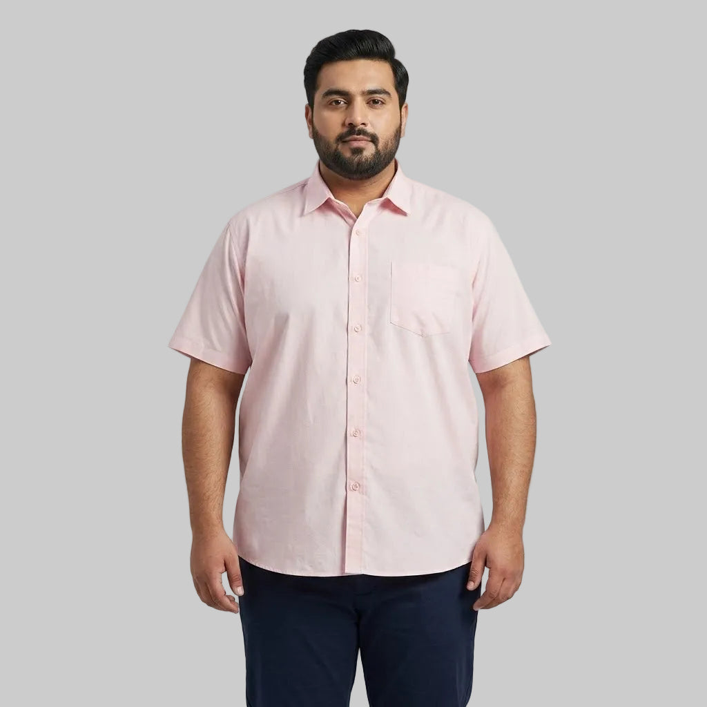 Men's pink casual short sleeve button-up shirt with a classic spread collar and front button closure laid flat on a white background.