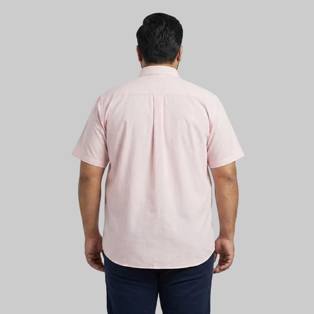 Men's pink casual short sleeve button-up shirt with a classic spread collar and front button closure laid flat on a white background.