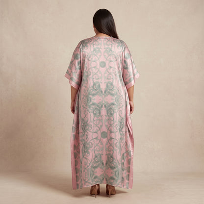 Pink and sage green damask print maxi kaftan made from lightweight polyester with an elegant pattern and flowing silhouette.