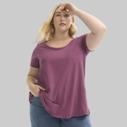 Plus size woman wearing a Plum Blossom Short Sleeve Cotton Tee with a relaxed fit, soft cotton fabric, and casual everyday style.