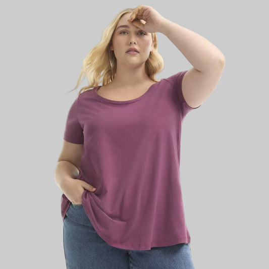 Plus size woman wearing a Plum Blossom Short Sleeve Cotton Tee with a relaxed fit, soft cotton fabric, and casual everyday style.