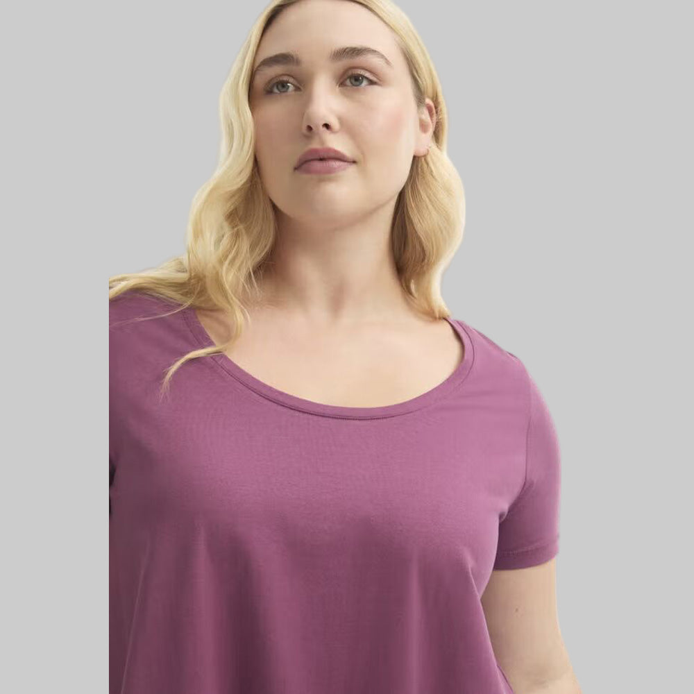 Plus size woman wearing a Plum Blossom Short Sleeve Cotton Tee with a relaxed fit, soft cotton fabric, and casual everyday style.