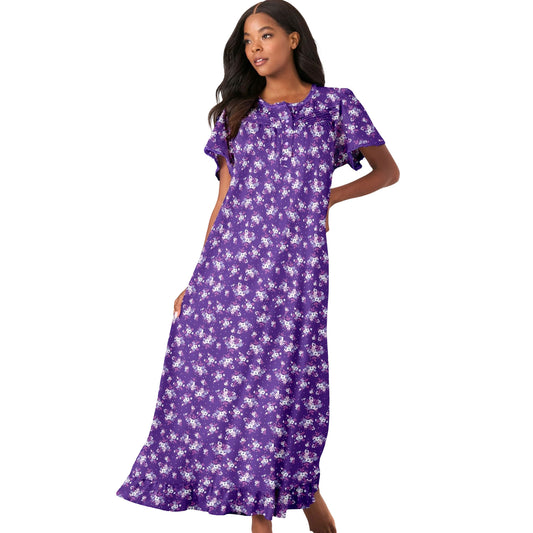 Plus size woman in plum floral long cotton gown with ruffle trim