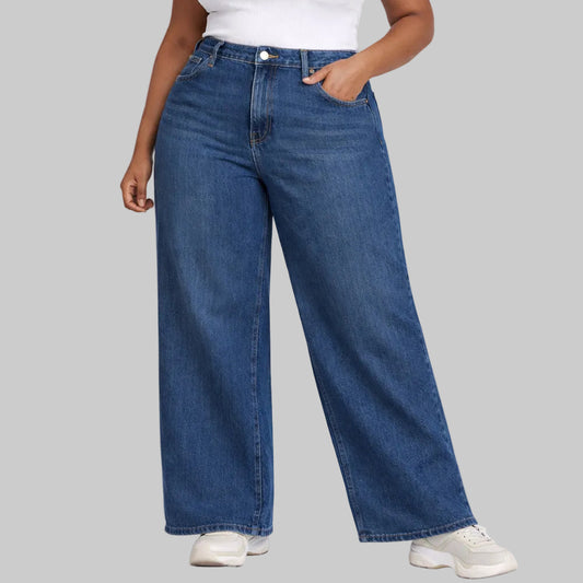 Plus size comfort fit wide leg blue denim jeans front view on model