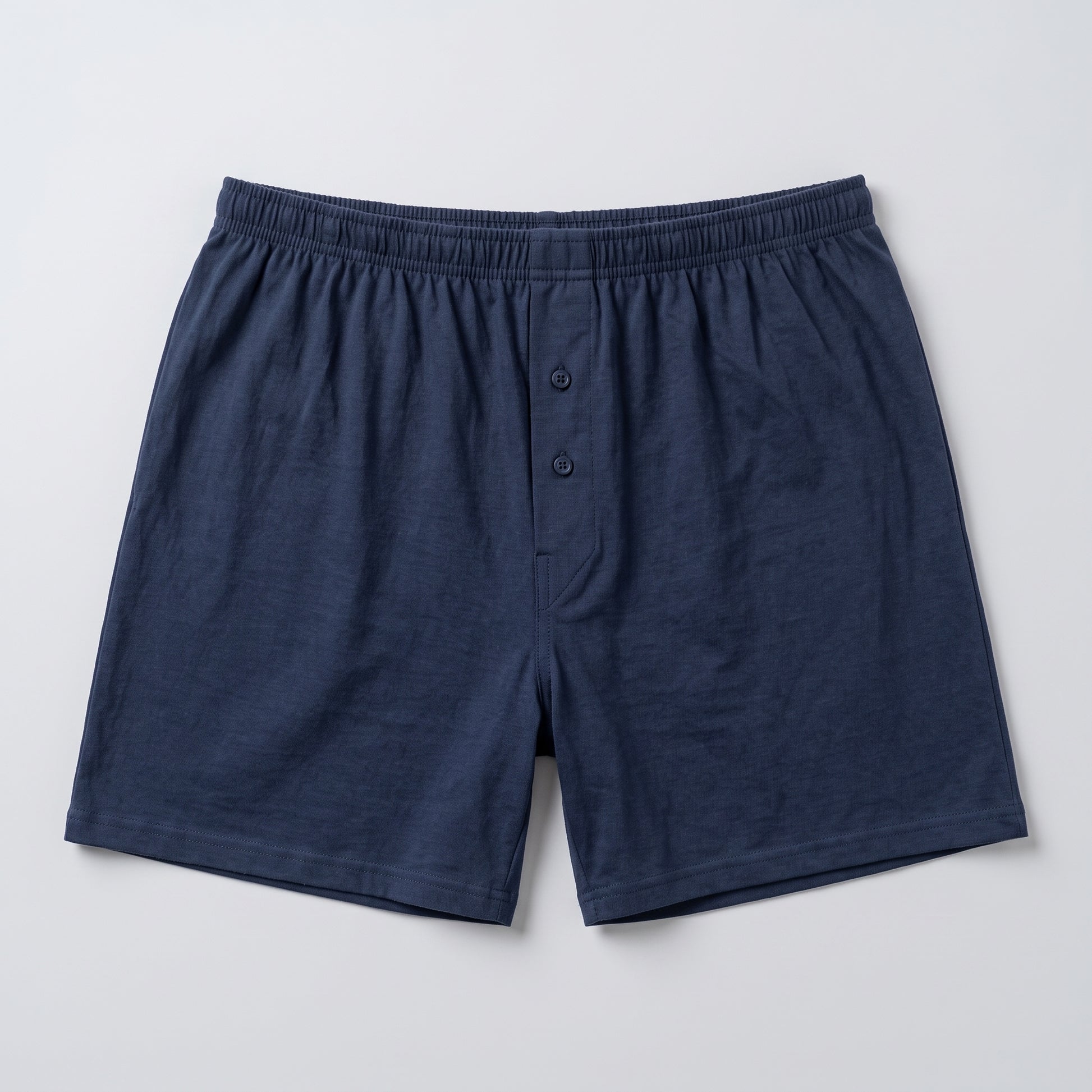 A pair of men's navy blue shorts with an elastic waistband and a Two-button placket, laid flat on a light gray background.
